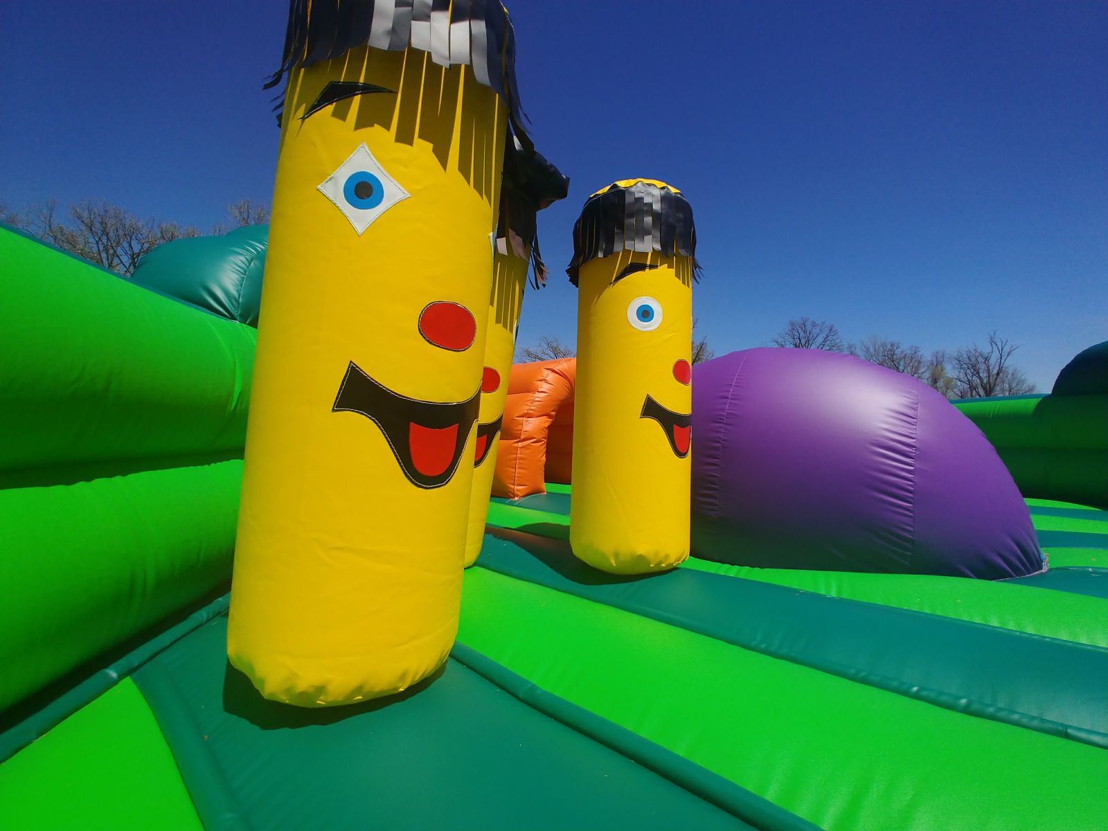 Inflatable obstacles inside bounce house rental for small children.